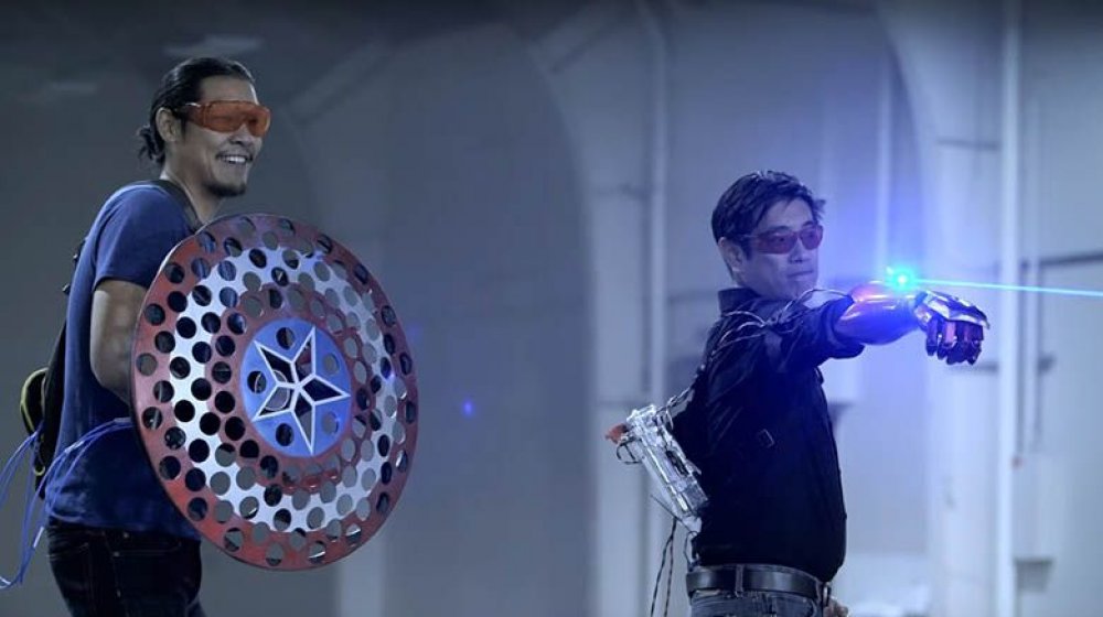 Grant Imahara with Iron Man's gauntlet and Allen Pan with Captain America's shield