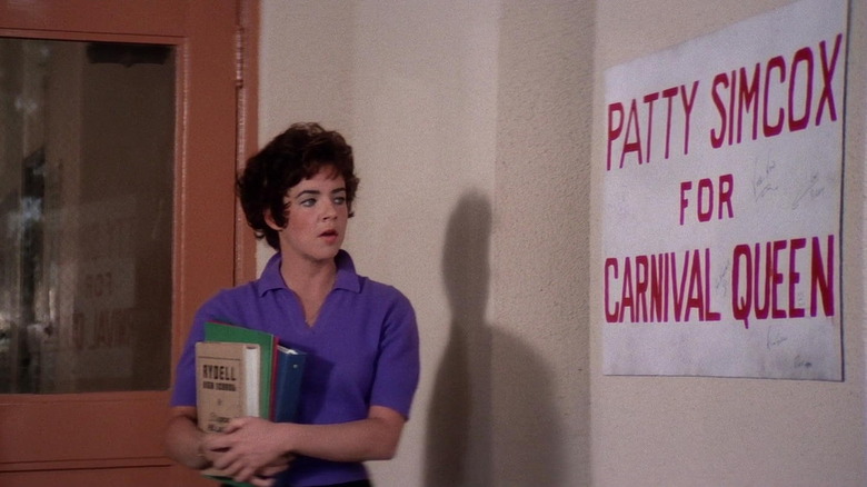 Rizzo standing in Rydell High