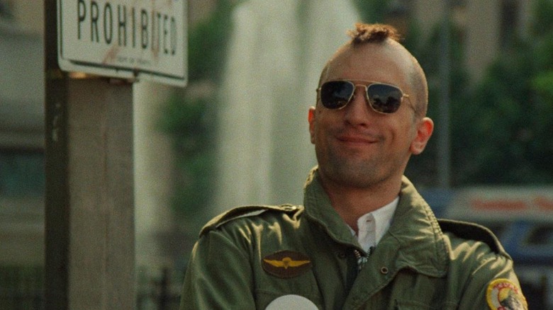 Travis Bickle smiling with mohawk