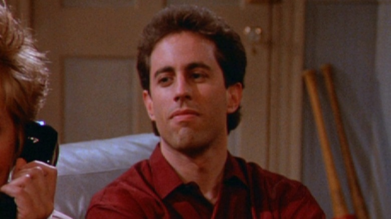 Seinfeld looks on menacingly.