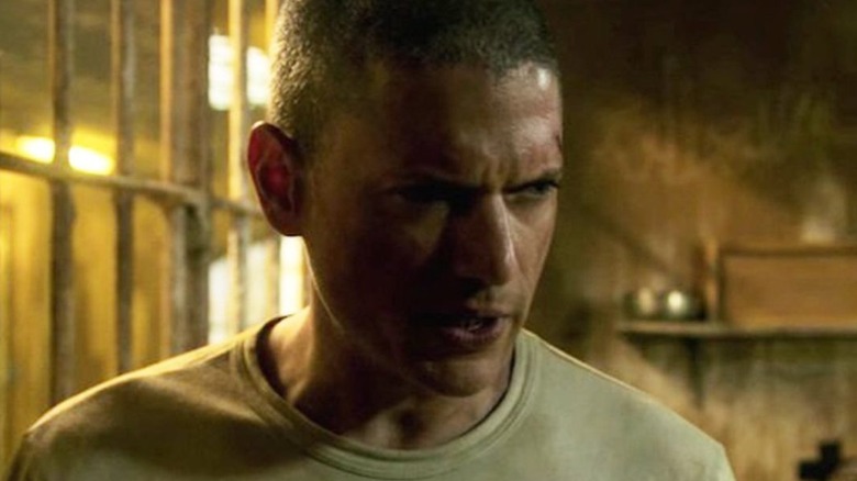 An exasperated Scofield looks on.