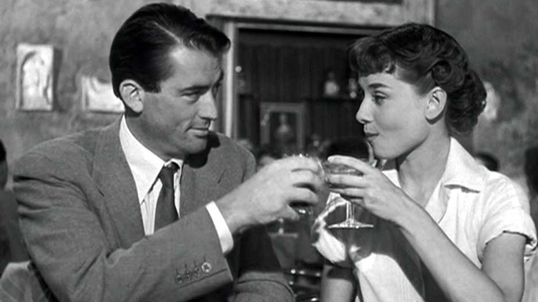 Gregory Peck and Audrey Hepburn toast