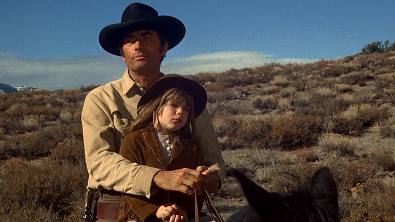 Peck on horseback with young girl