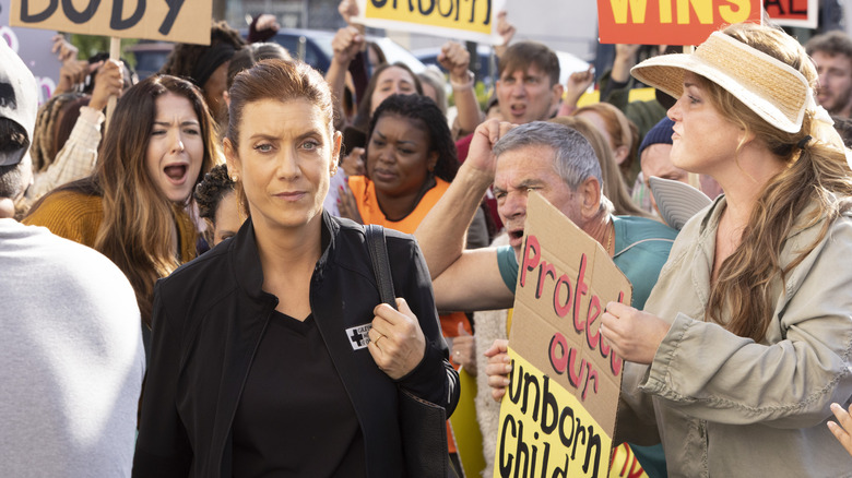 Addison Montgomery in the middle of protesters