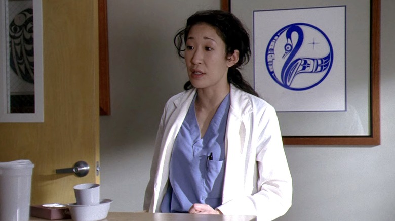 Cristina stands in lab coat 