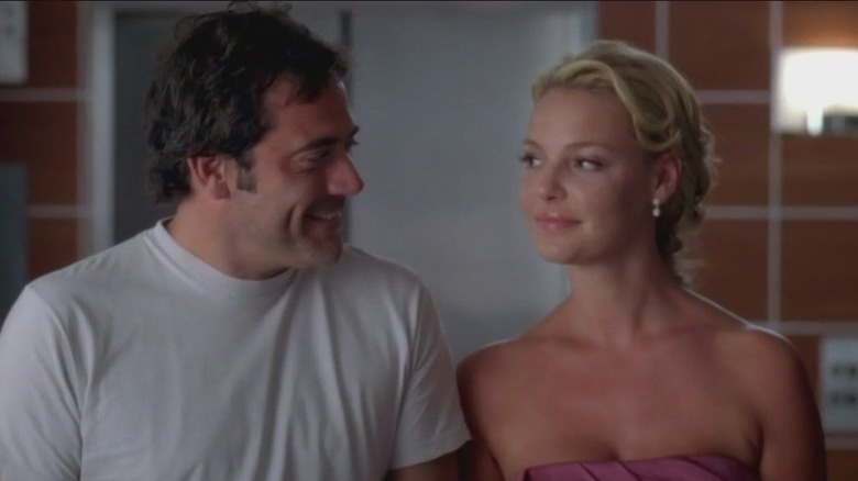 Izzie and Denny look at each other 