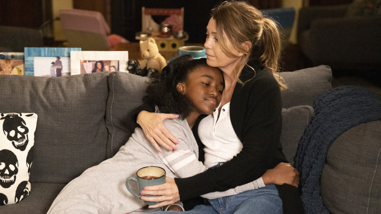 Zola and Meredith embracing