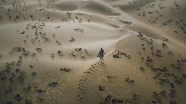 Concept art showing Doctor Strange surrounded by corpses in the desert