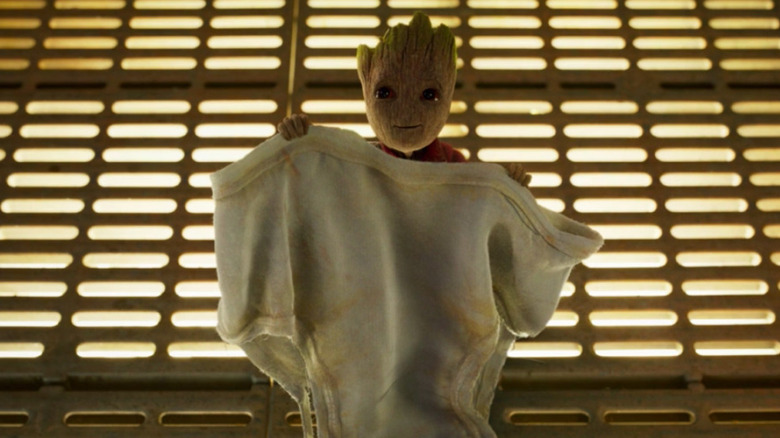 Baby Groot holds up a pair of briefs