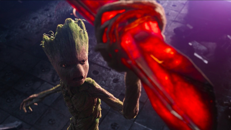 Groot holding Stormbreaker's glowing hot axe blade