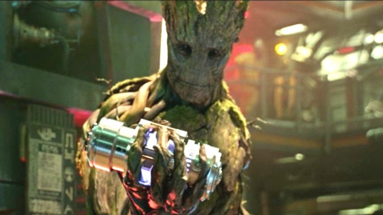 Groot holds a battery