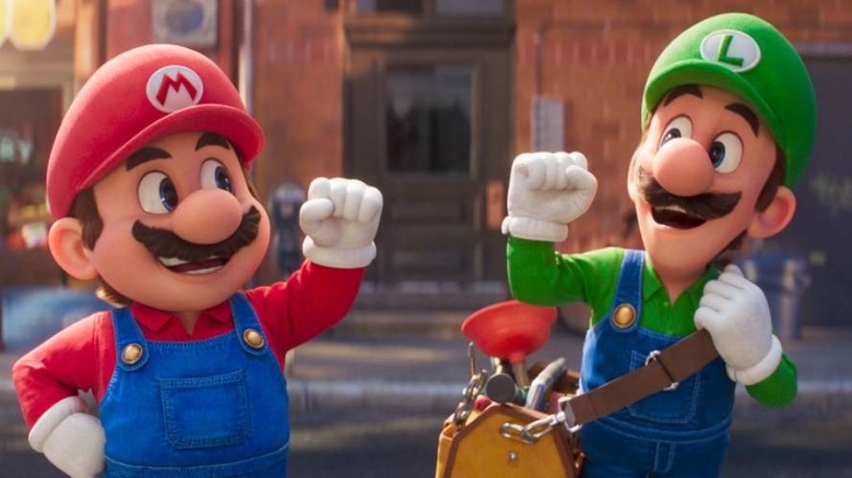 Mario fist bumping Luigi