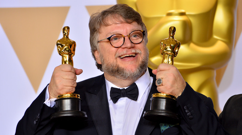 Guillermo del Toro holds Oscars