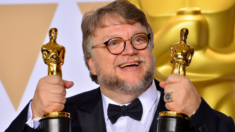 Guillermo del Toro holds two oscars