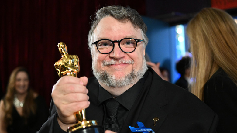 Guillermo Del Toro holding Oscar