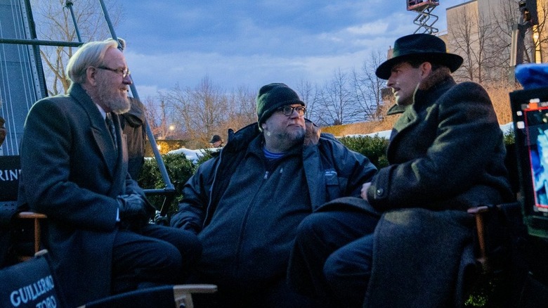 Jenkins, del Toro, and Cooper on set