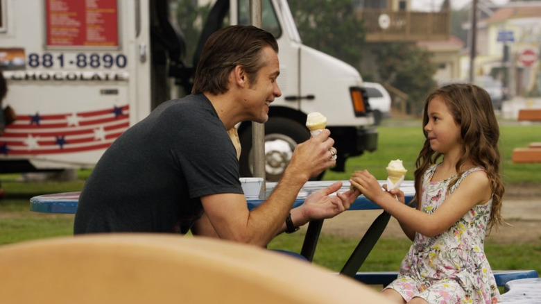 Raylan Givens and daughter eating ice cream