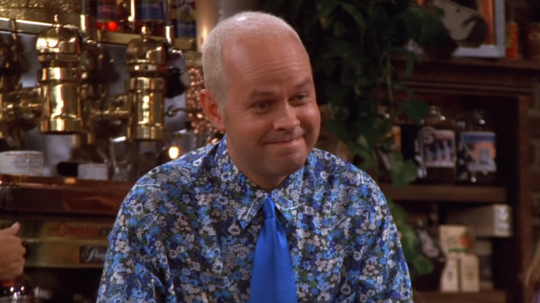 Gunther wearing a floral blue shirt and smiling