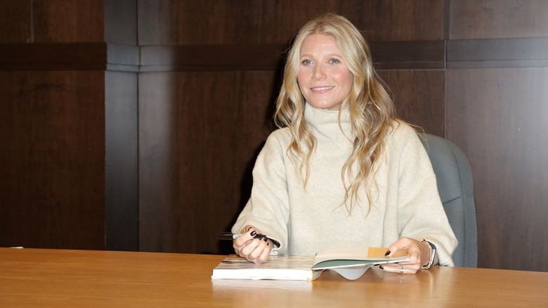 Gwyneth Paltrow signing a book