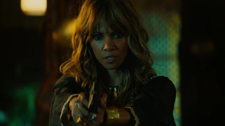 Halle Berry holding gun