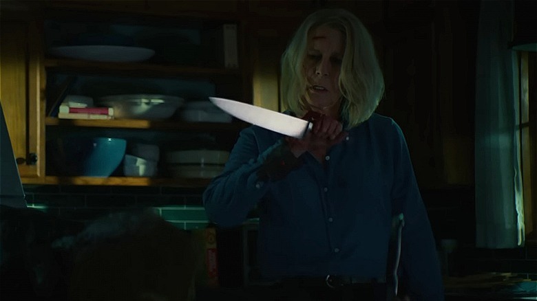 Laurie wielding a knife