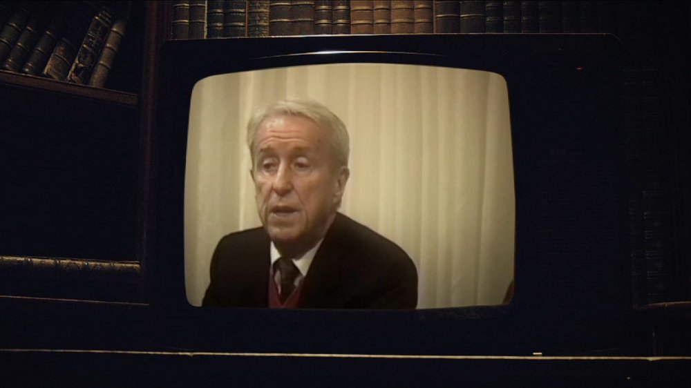 An old television showing footage of Malachi Martin