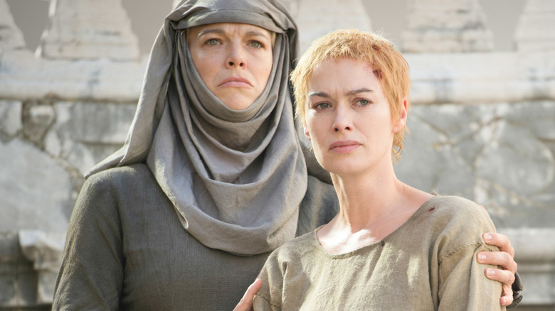 Septa Unella holds Cersei Lannister