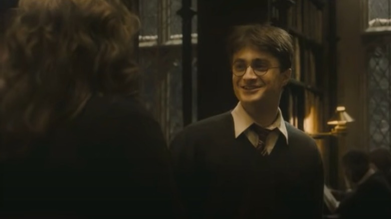 Daniel Radcliffe laughing after Emma Watson hit him