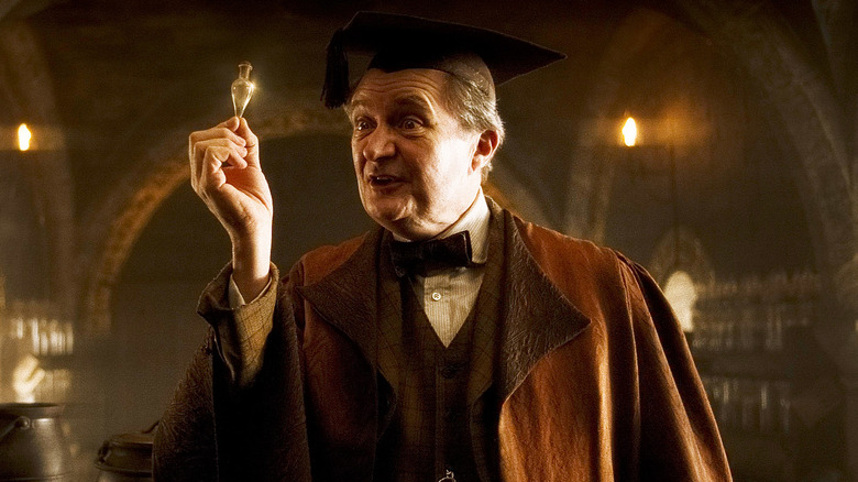 Slughorn holds a vial