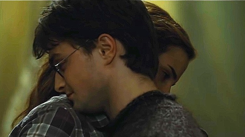 Harry and Hermione heads on each other's shoulders