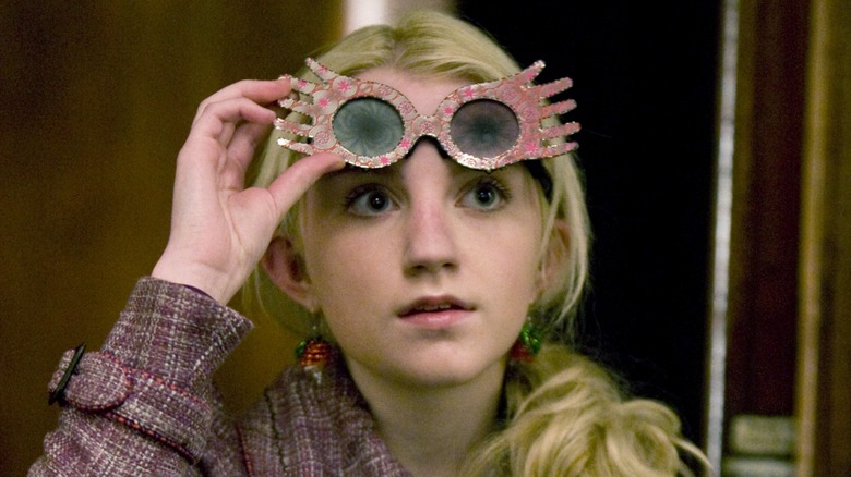 Luna Lovegood lifts her glasses