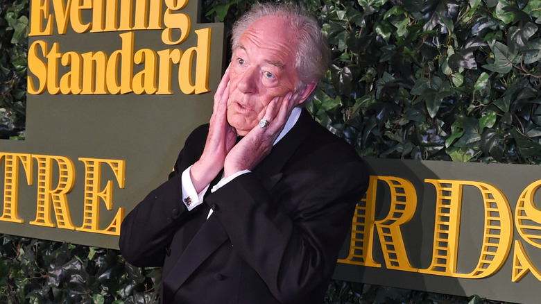 Michael Gambon hands on face