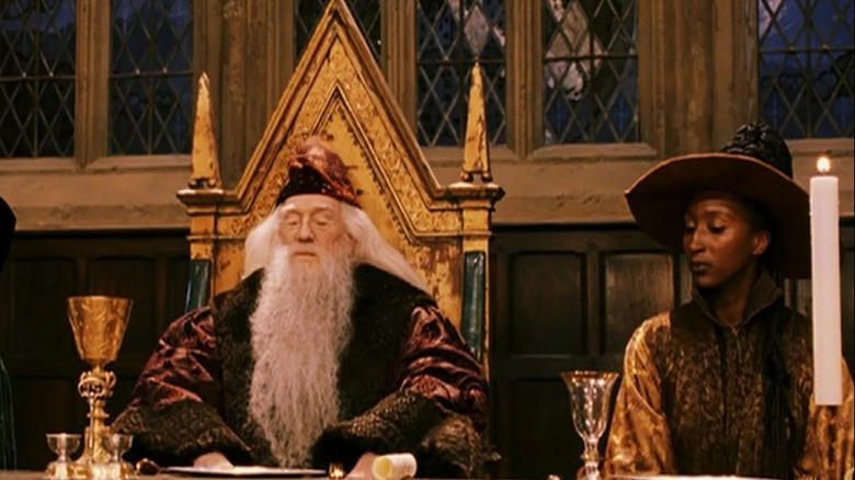 Professor Dumbledore and Professor Sinistra seated for a feast