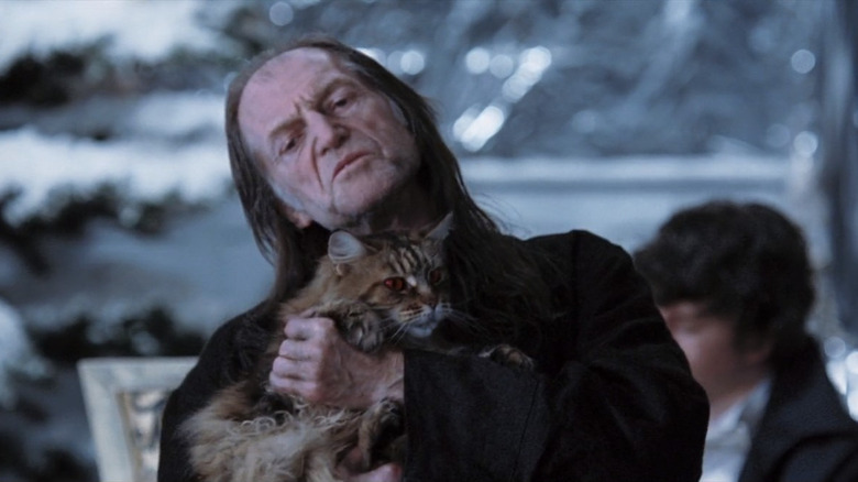 Argus Filch dancing with Mrs. Norris