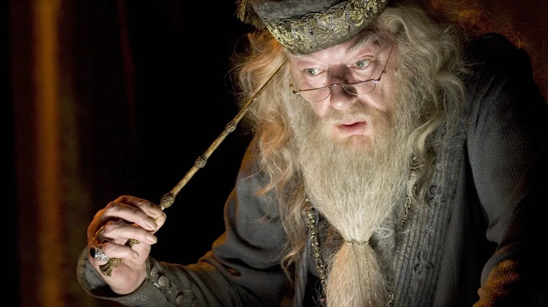 Dumbledore pulling memory with wand