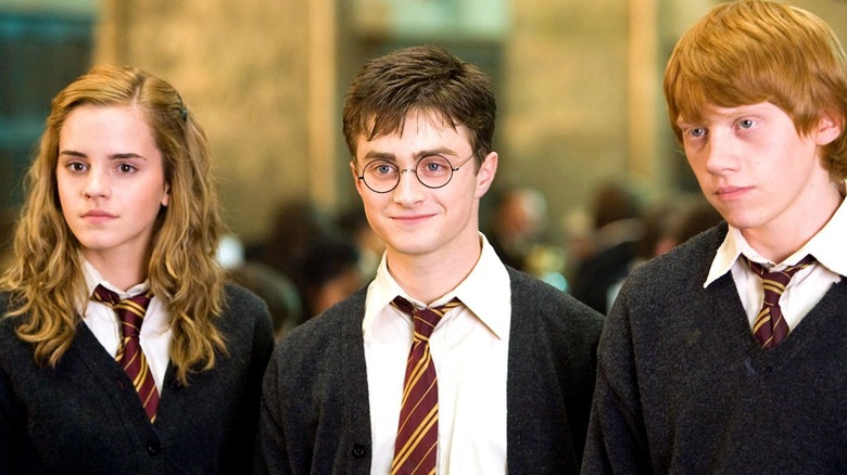 Hermione, Harry, and Ron smiling