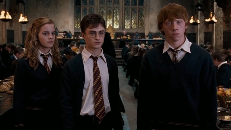 Ron, Hermione, and Harry looking serious