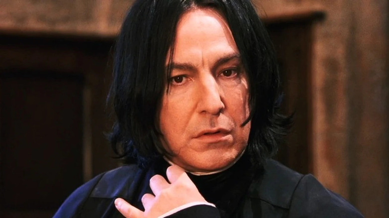 Snape pulling at collar