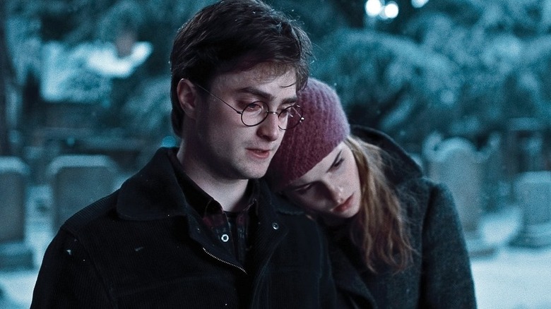 Hermione leaning head on Harry's shoulder