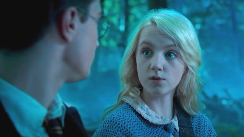 Luna Lovegood giving Harry a surprised look