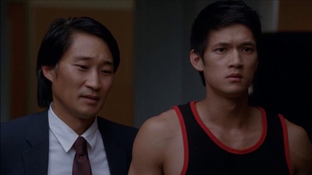 Mike with his dad in a black tank top in Glee