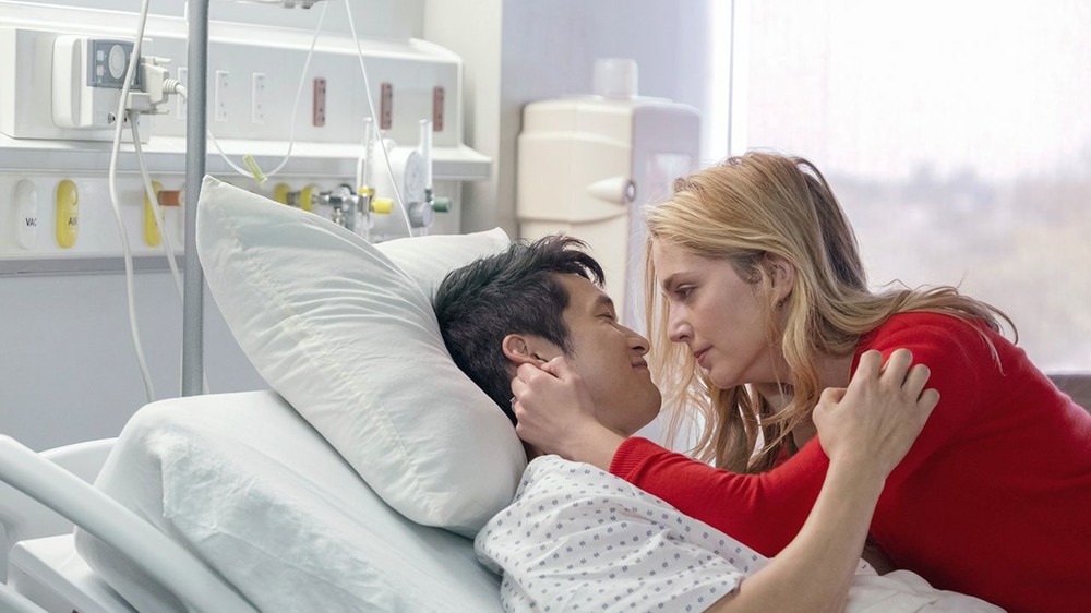 Sol and Jen hug on a hospital bed in All My Life