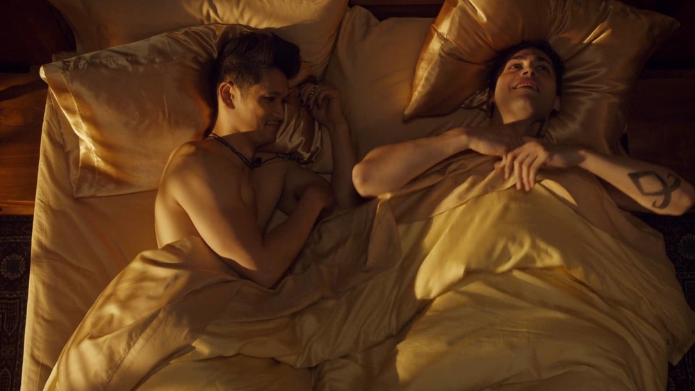 Magnus and Alec smiling in bed in Shadowhunters