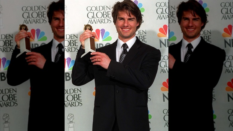 Tom Cruise posing with Golden Globe award