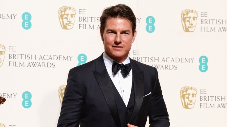 Tom Cruise posing at BAFTAs