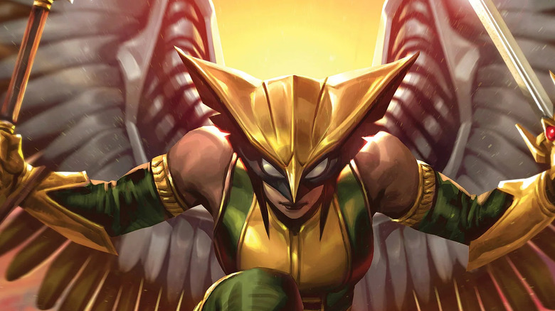 Hawkgirl holding a sword and mace