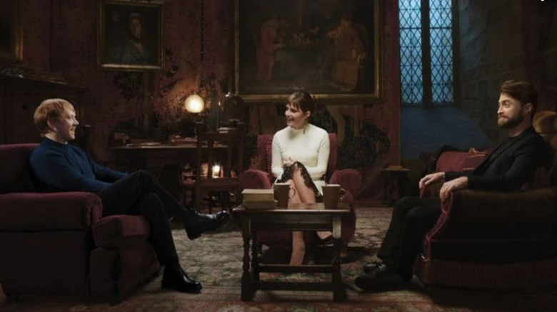 Rupert Grint, Emma Watson, and Daniel Radcliffe sitting in Hogwarts room