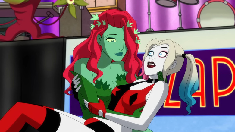 Poison Ivy holding Harley Quinn