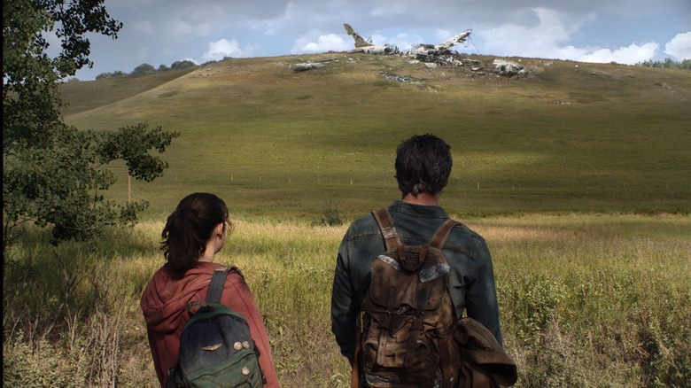 Joel and Ellie staring at plane crash