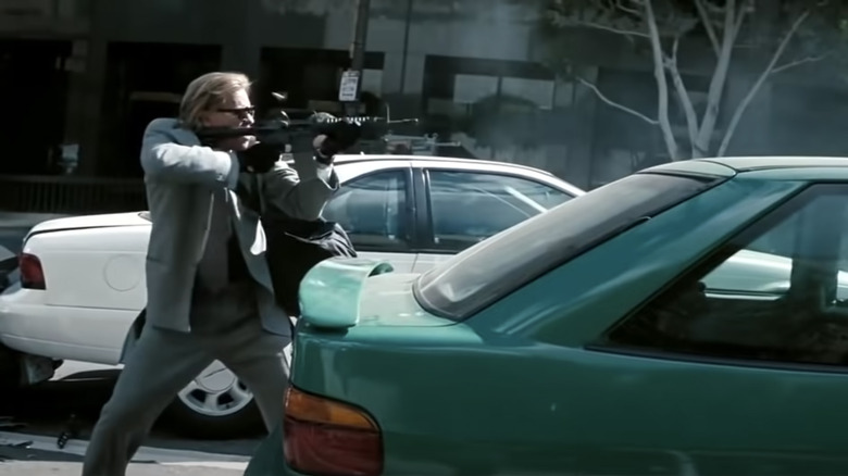 Val Kilmer as Chris Shiherlis shooting heist